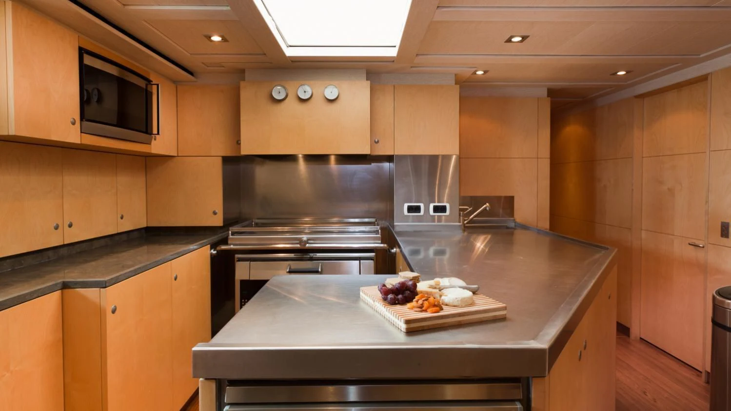 a kitchen with a large island aboard GUILLEMOT Yacht for Sale