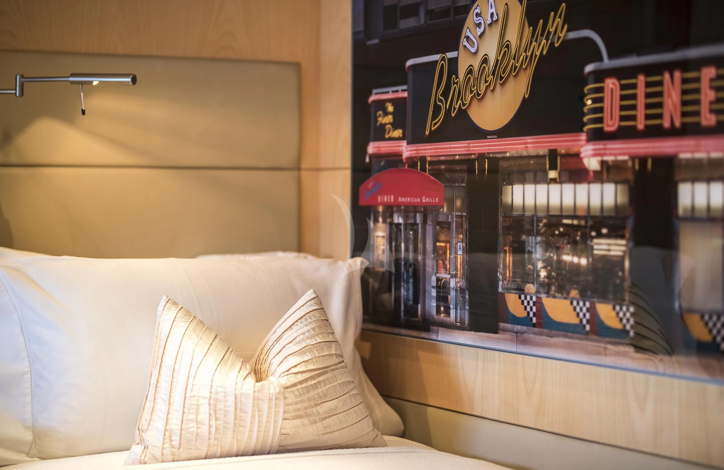 a bed with a red umbrella aboard GUILLEMOT Yacht for Sale