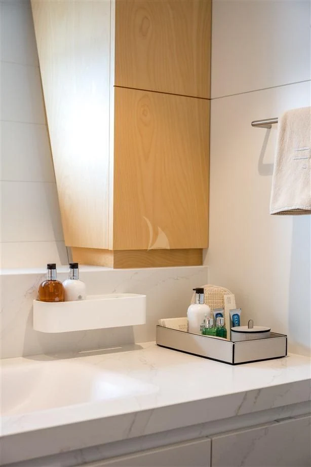 a bathroom with a mirror and a sink aboard GUILLEMOT Yacht for Sale