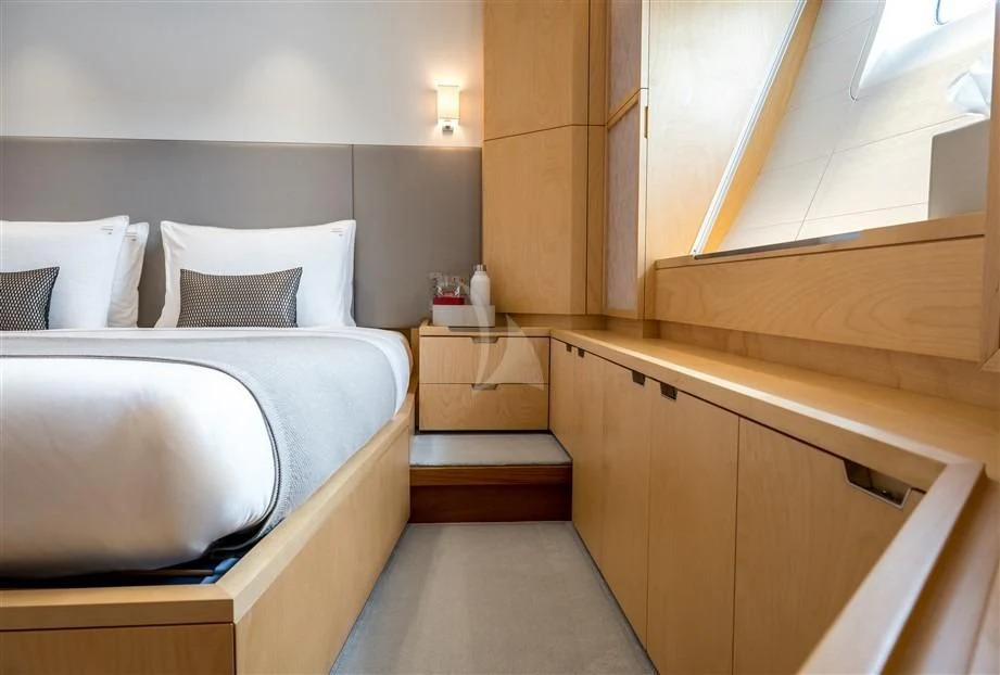 a bed with a white sheet aboard GUILLEMOT Yacht for Sale