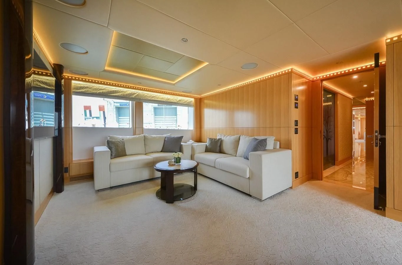 a living room with a couch and a table aboard MAJESTY 155 Yacht for Sale