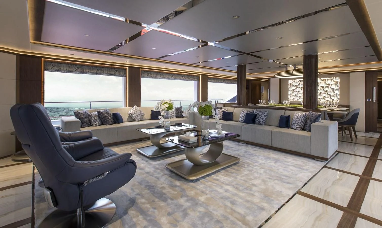 a living room with a couch and a table aboard MAJESTY 155 Yacht for Sale