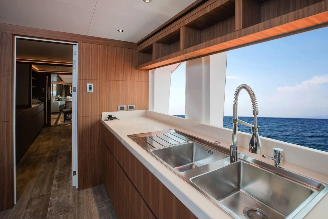 a kitchen with a sink and a window aboard MAJESTY 155 Yacht for Sale