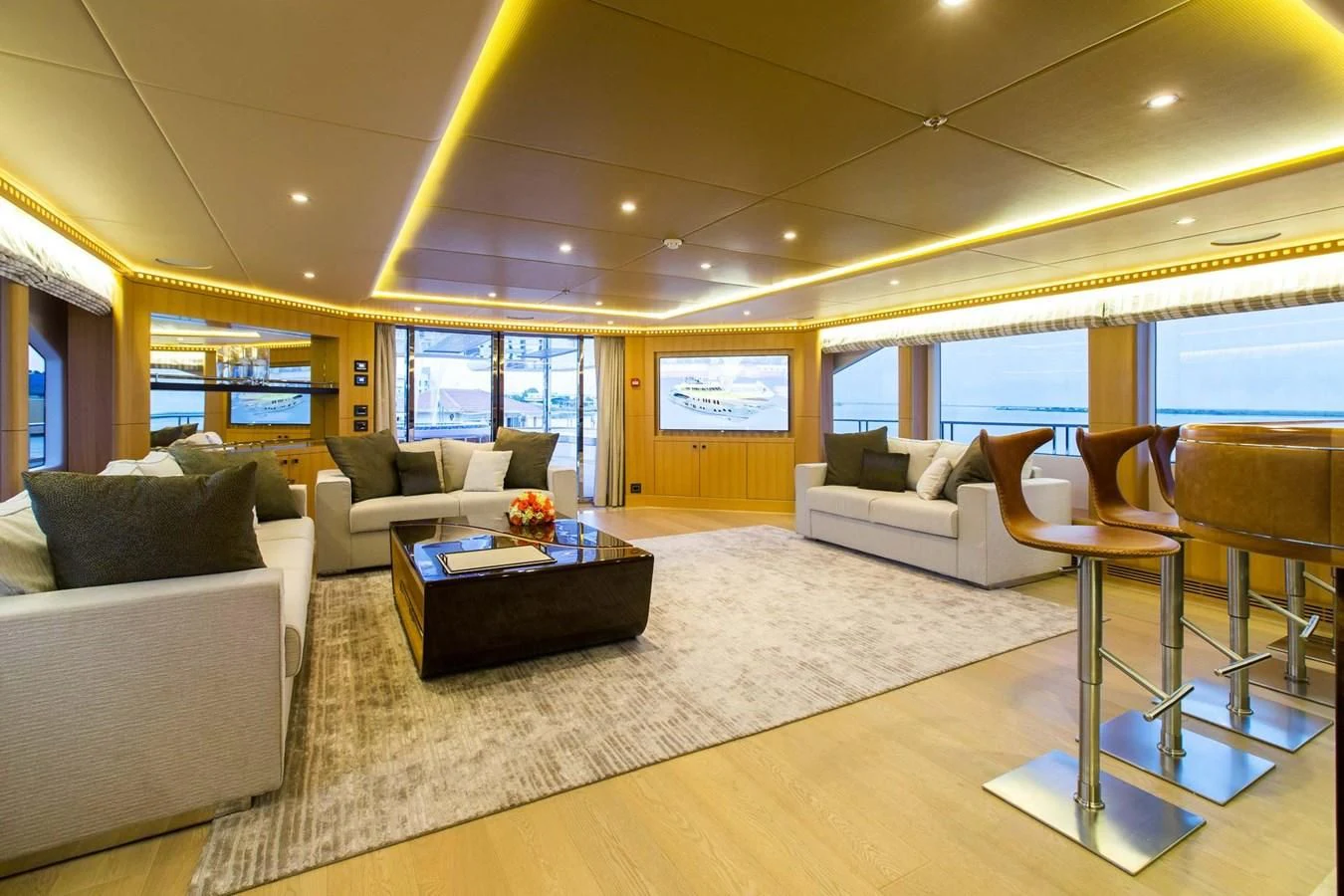 a living room with a large window aboard MAJESTY 155 Yacht for Sale