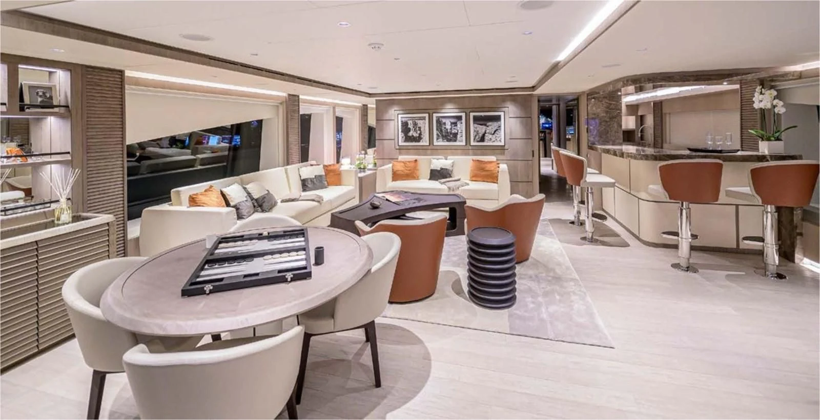 a room with a table chairs and a couch aboard MAJESTY 155 Yacht for Sale