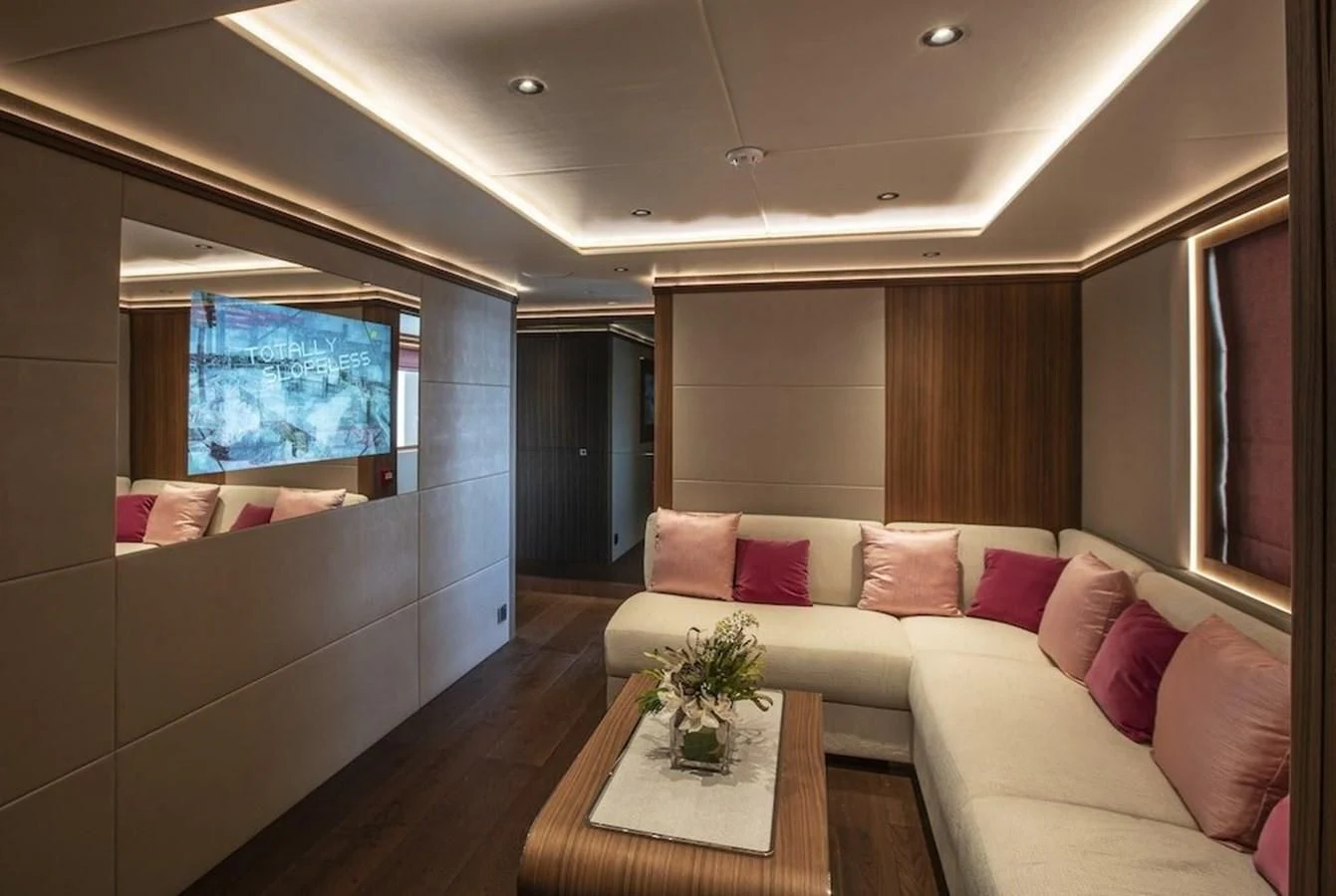 a living room with a couch and a table aboard MAJESTY 155 Yacht for Sale