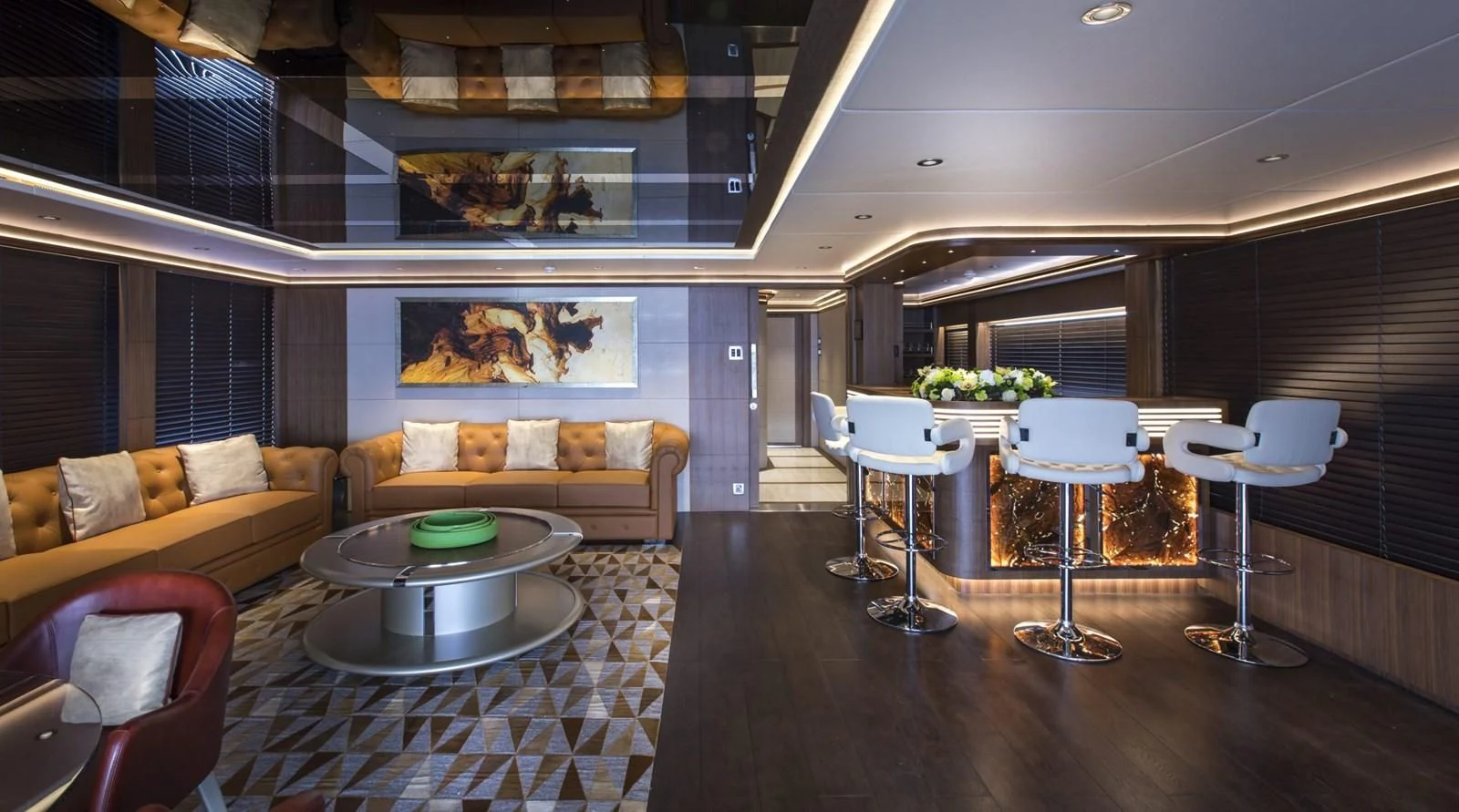 a living room with a table and chairs aboard MAJESTY 155 Yacht for Sale