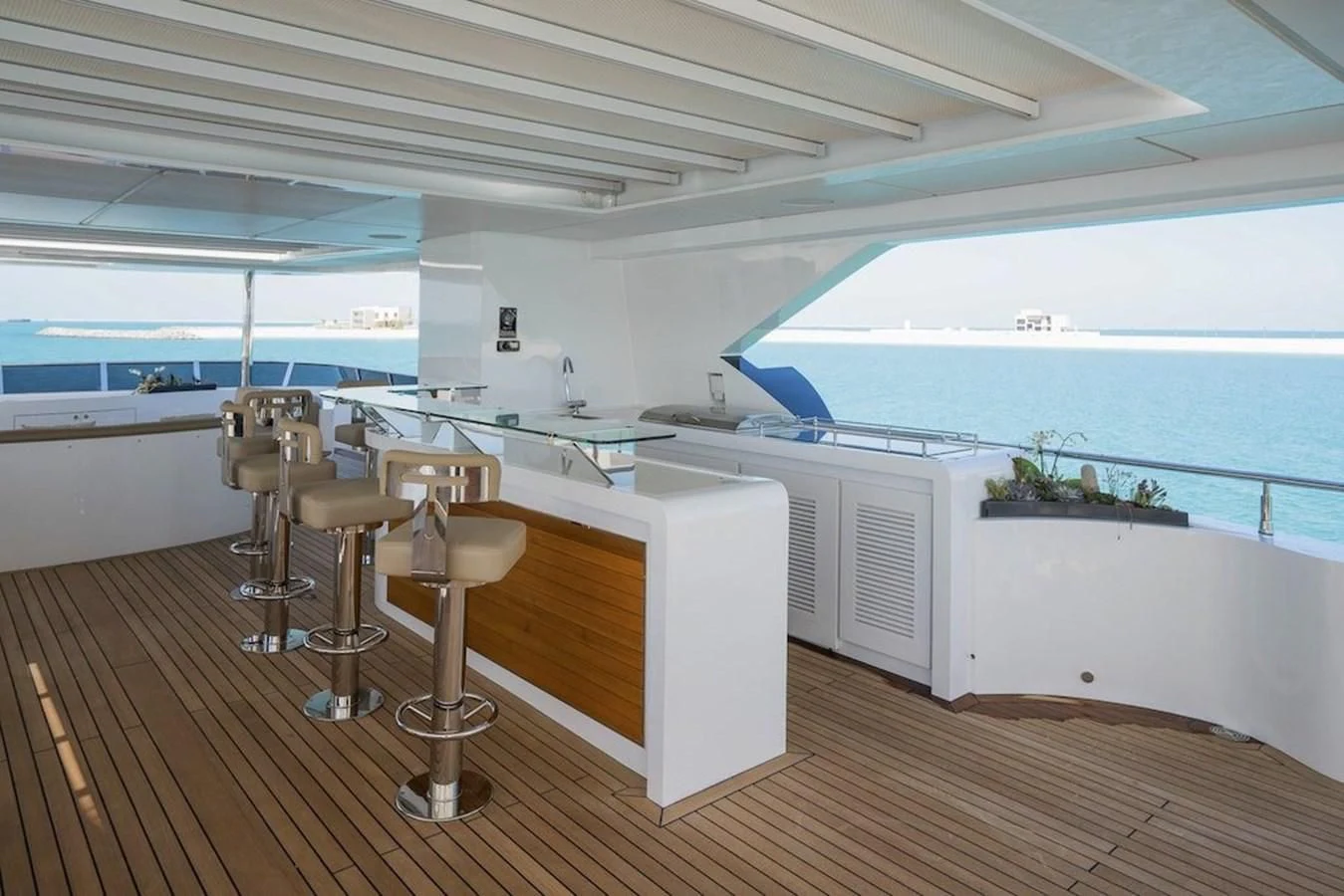 a room with a table and chairs aboard MAJESTY 155 Yacht for Sale