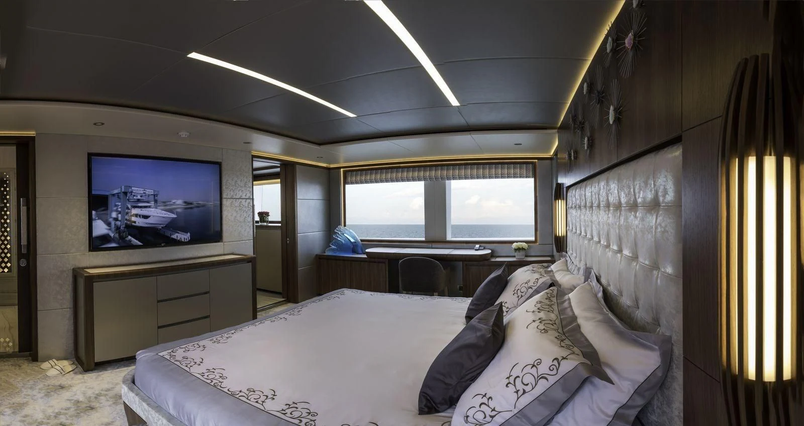 a bedroom with a bed and a tv aboard MAJESTY 155 Yacht for Sale