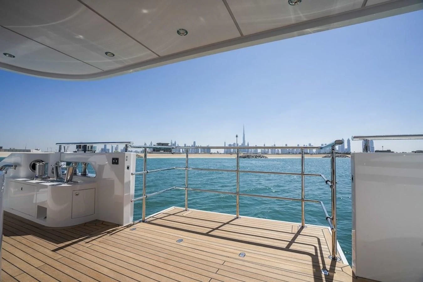 a deck with a large pool aboard MAJESTY 155 Yacht for Sale