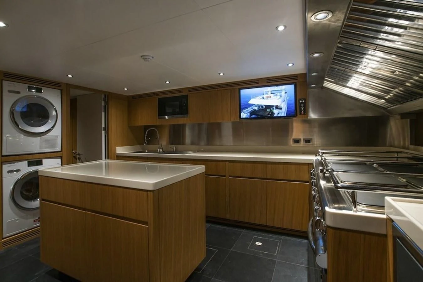 a kitchen with a large tv aboard MAJESTY 155 Yacht for Sale