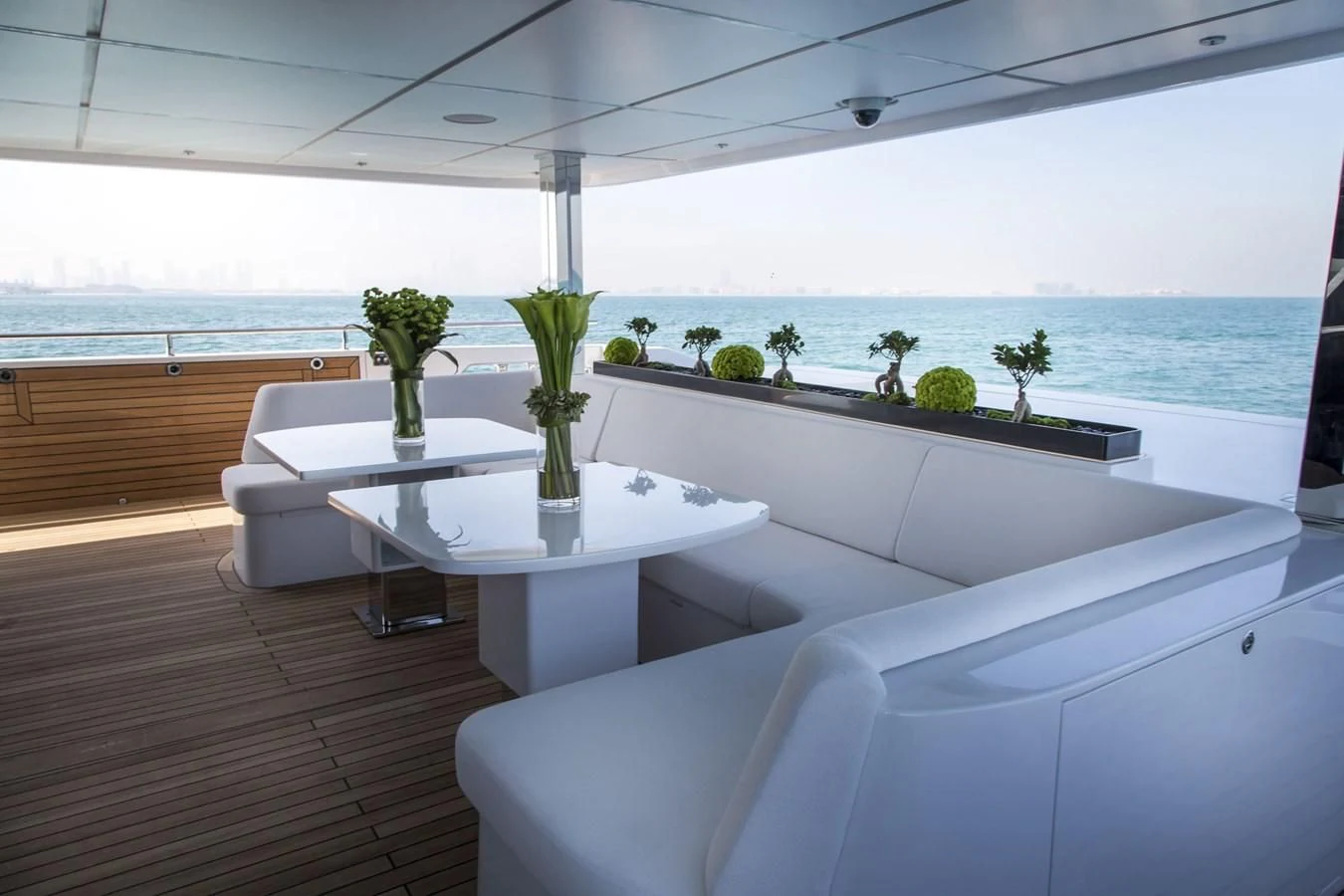 a room with a table and chairs aboard MAJESTY 155 Yacht for Sale