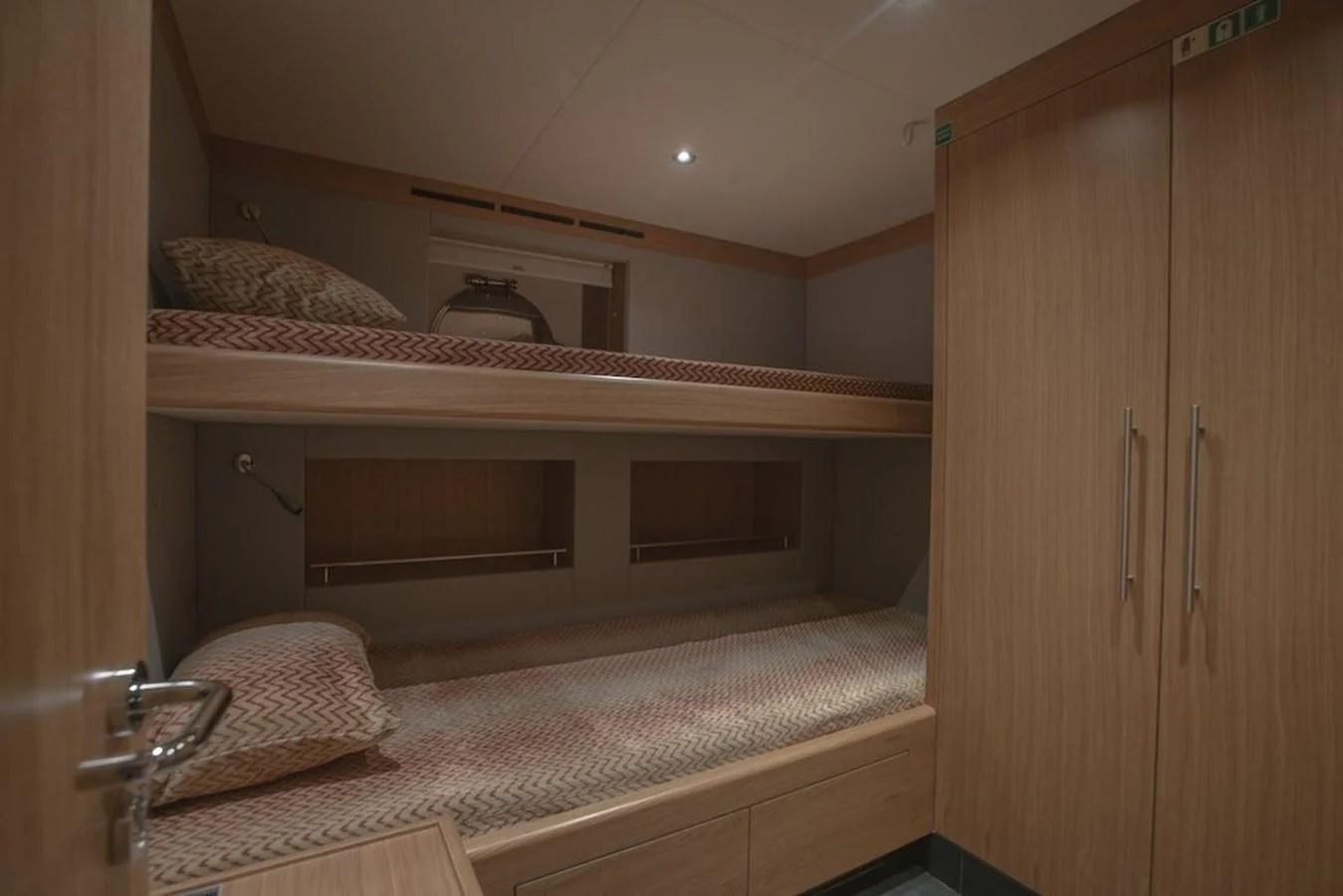 a room with a bed and a cupboard aboard MAJESTY 155 Yacht for Sale