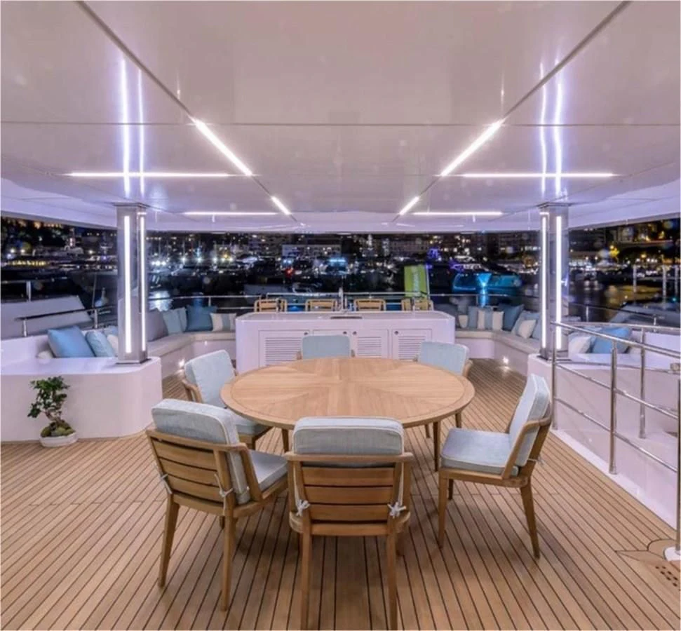 a modern looking restaurant with tables and chairs aboard MAJESTY 155 Yacht for Sale