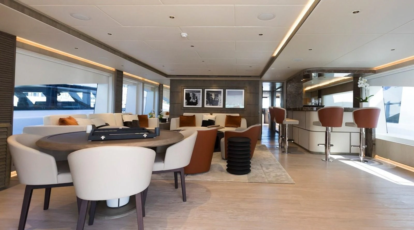 a room with tables and chairs aboard MAJESTY 155 Yacht for Sale