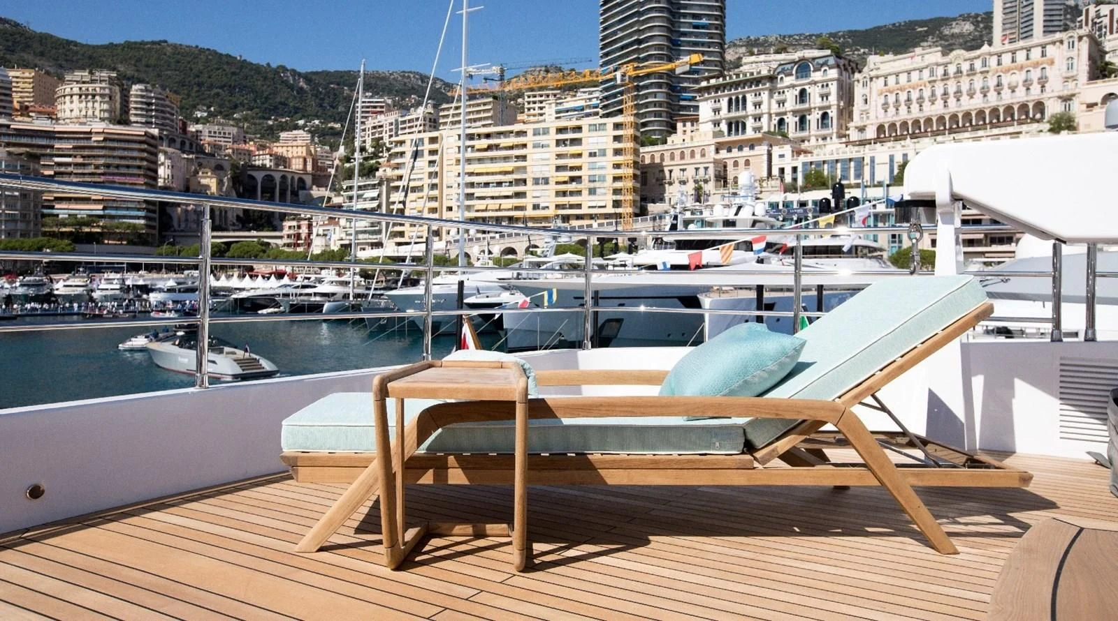 a deck with a bench and boats in the water aboard MAJESTY 155 Yacht for Sale