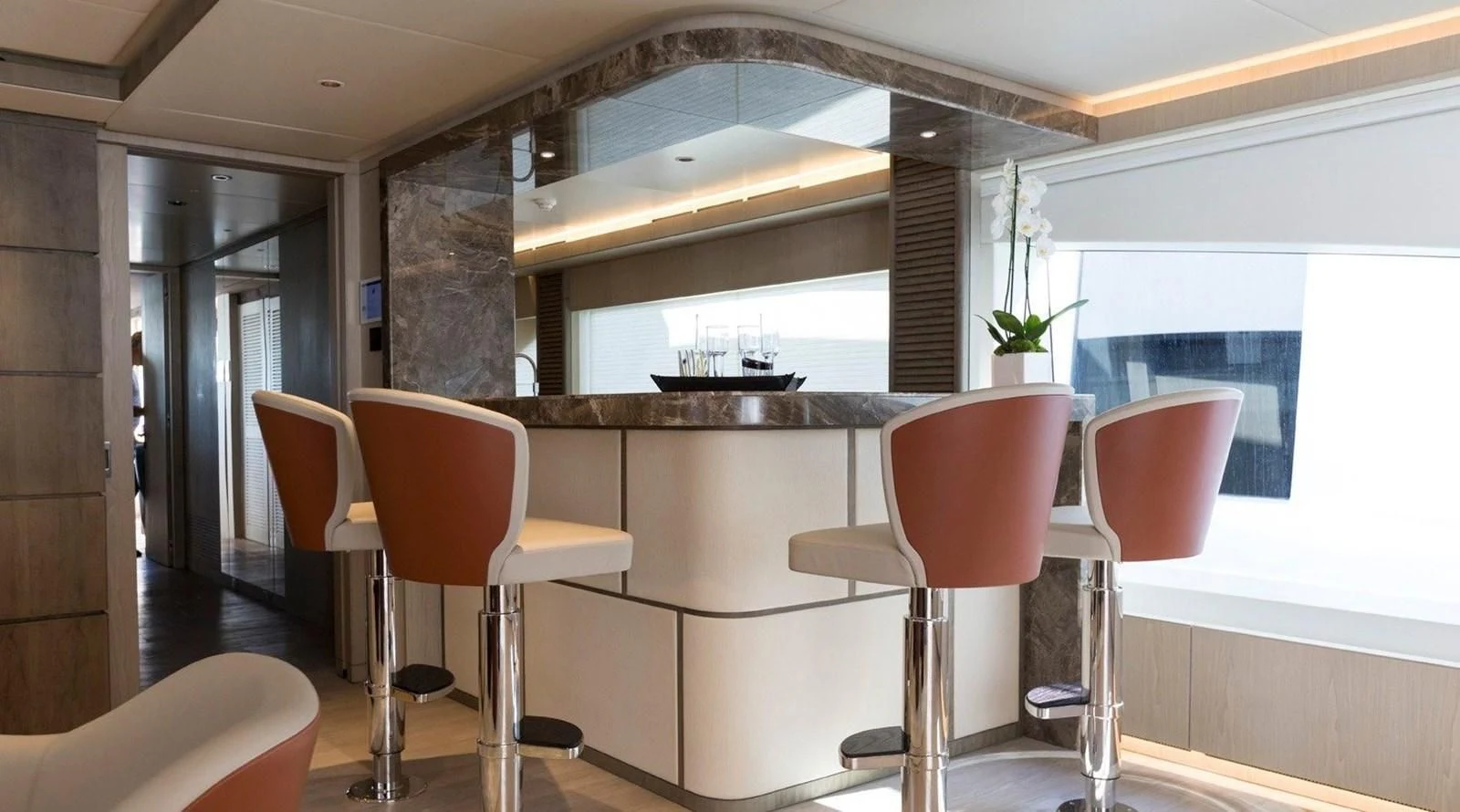 a room with chairs and tables aboard MAJESTY 155 Yacht for Sale