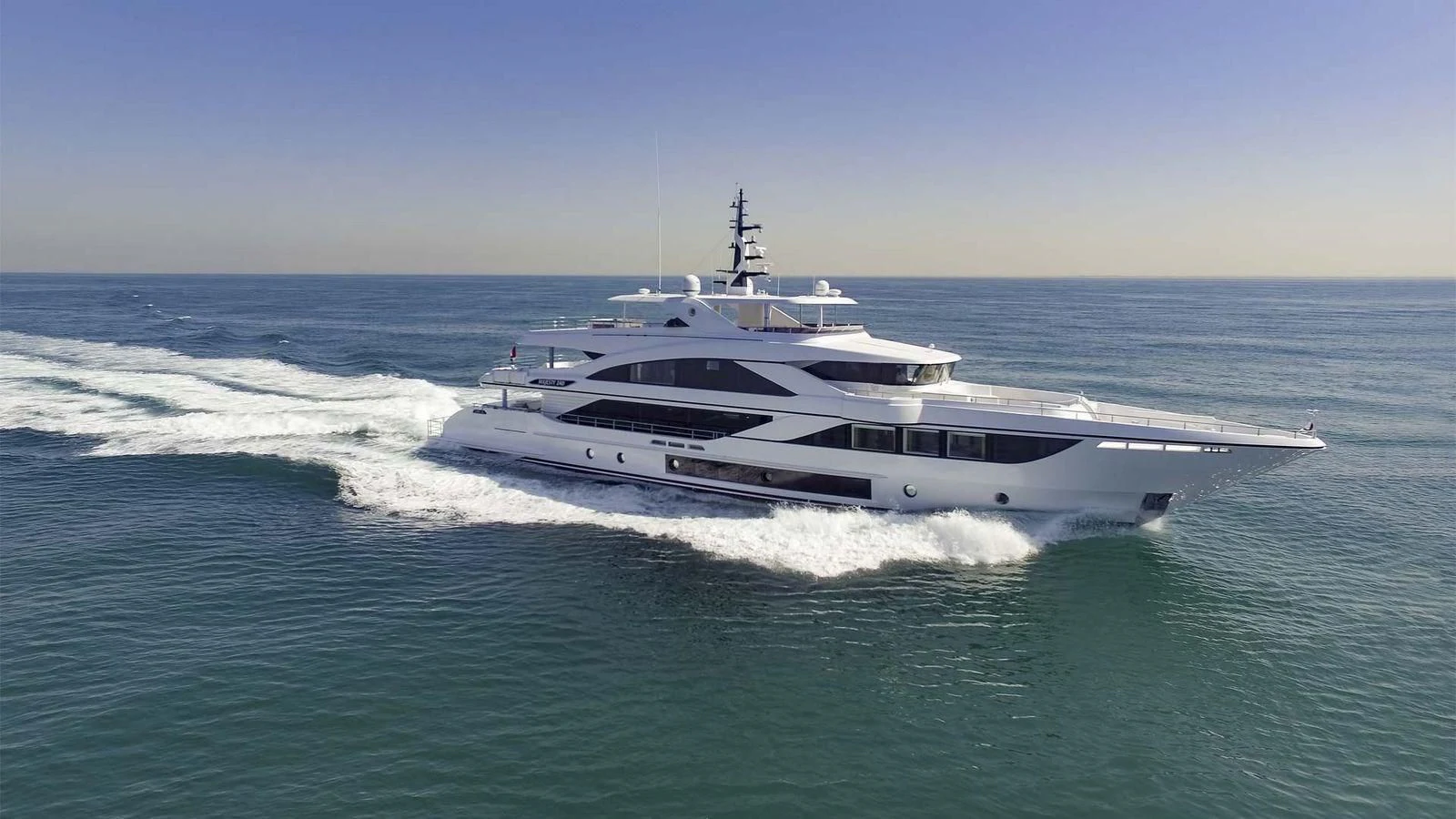 a white yacht on the water aboard MAJESTY 155 Yacht for Sale