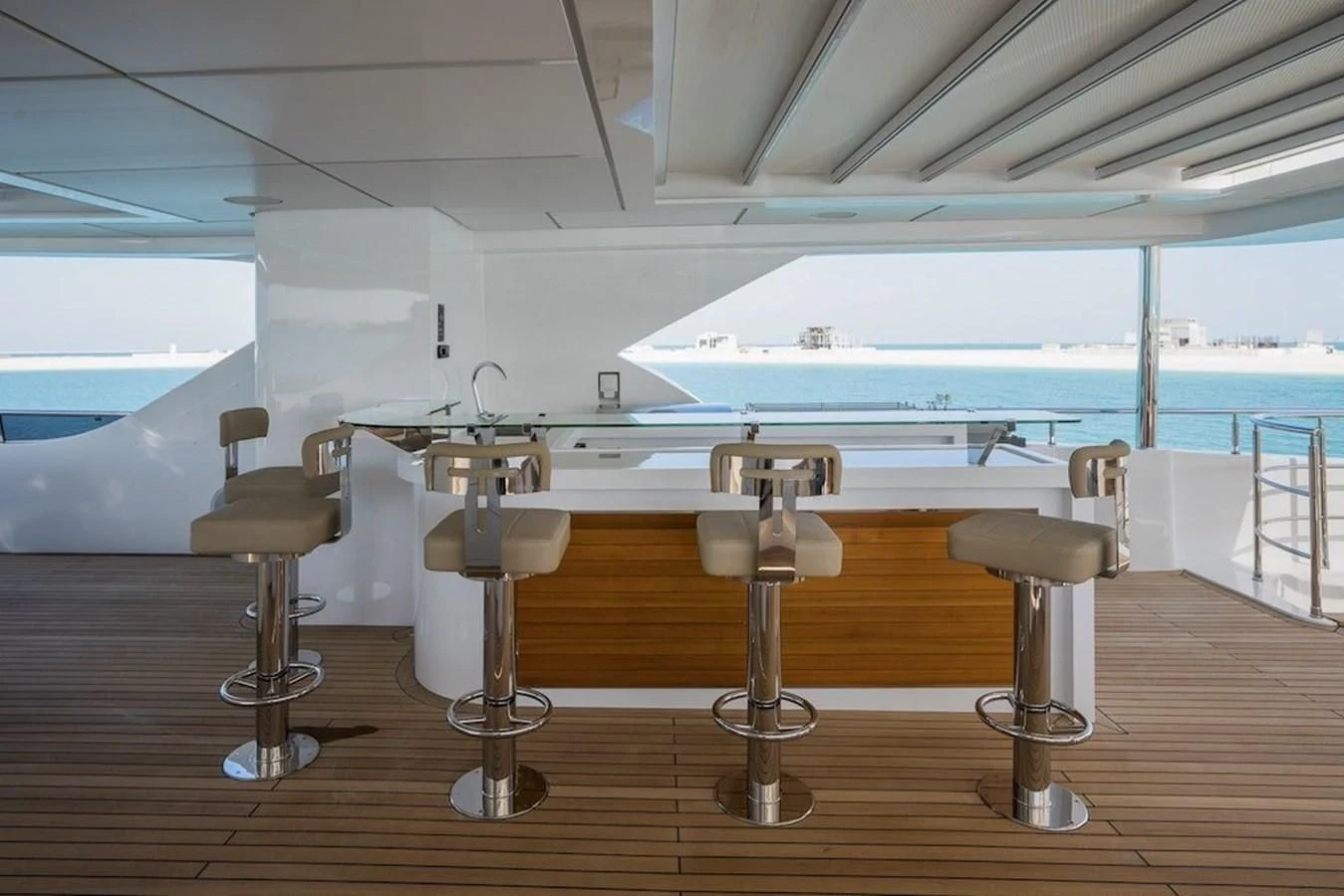 a room with a table and chairs aboard MAJESTY 155 Yacht for Sale