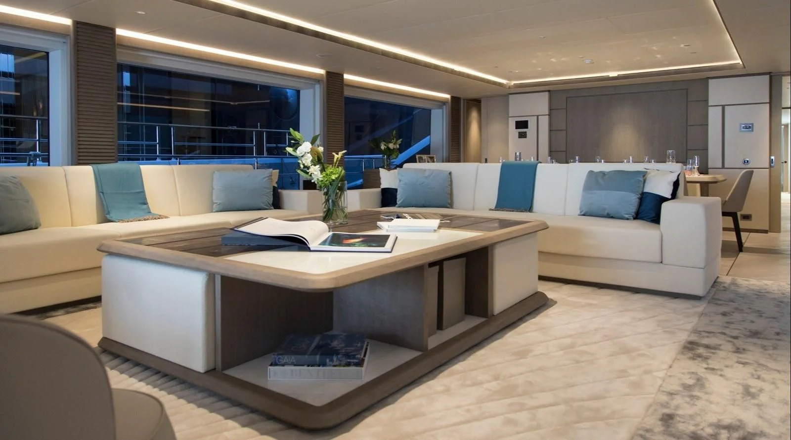 a large living room with a large table and couches aboard MAJESTY 155 Yacht for Sale