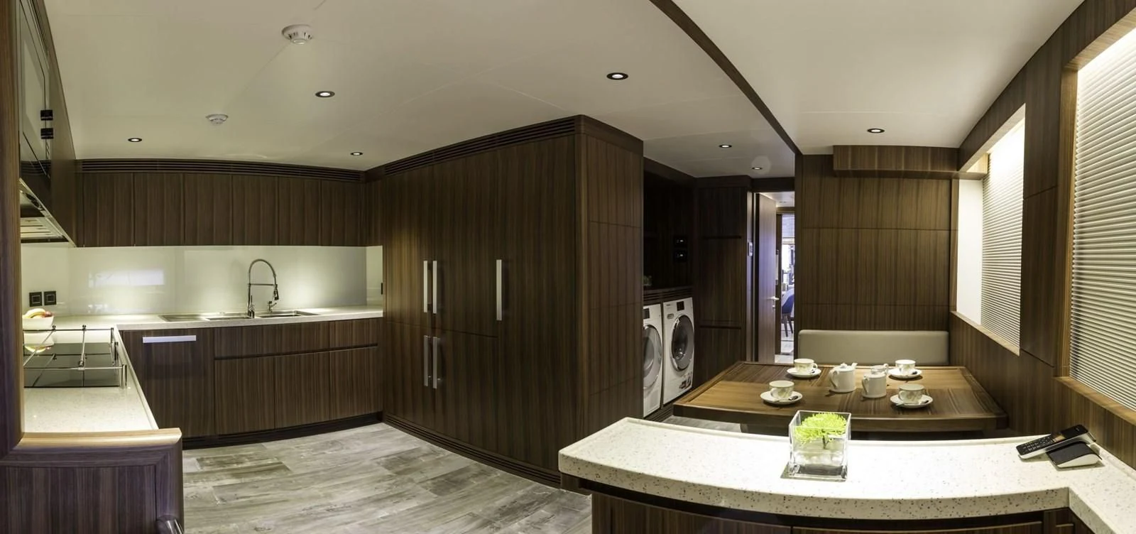 a kitchen with wooden cabinets aboard MAJESTY 155 Yacht for Sale