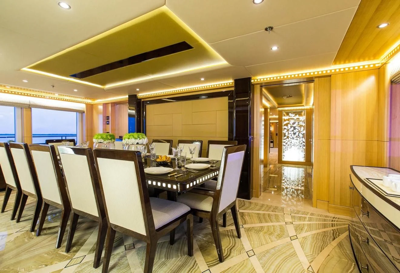a dining room with a table and chairs aboard MAJESTY 155 Yacht for Sale