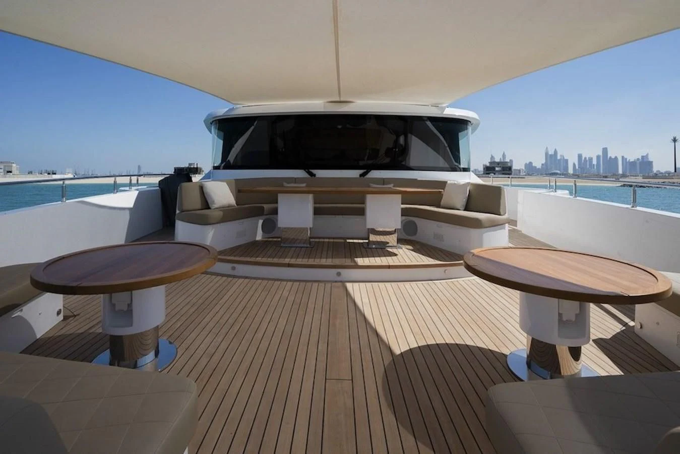 a room with a couch and a table on it aboard MAJESTY 155 Yacht for Sale