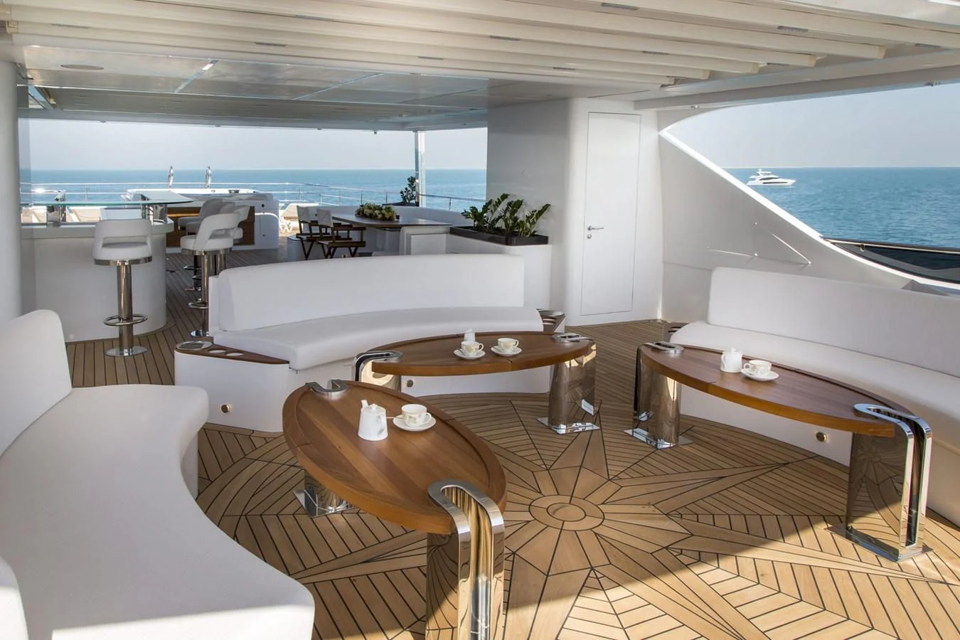a room with a table and chairs aboard MAJESTY 155 Yacht for Sale