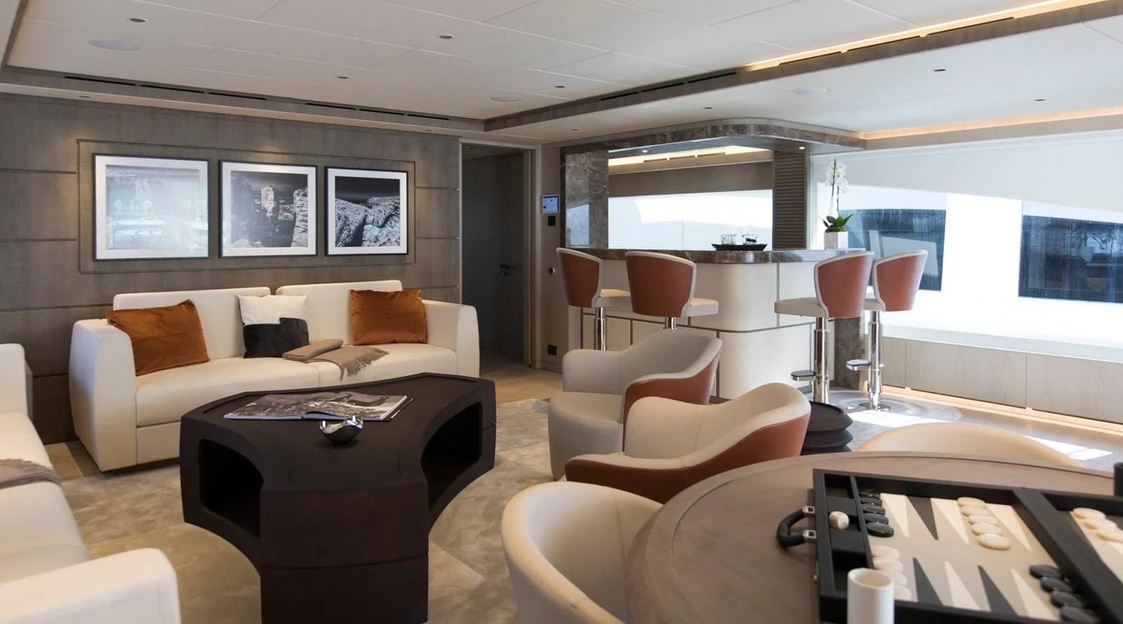 a living room with a couch and a table aboard MAJESTY 155 Yacht for Sale