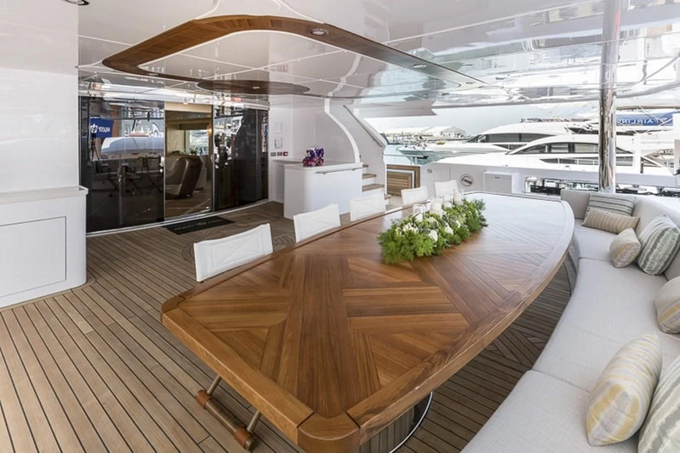 a room with a large table and couches aboard MAJESTY 155 Yacht for Sale