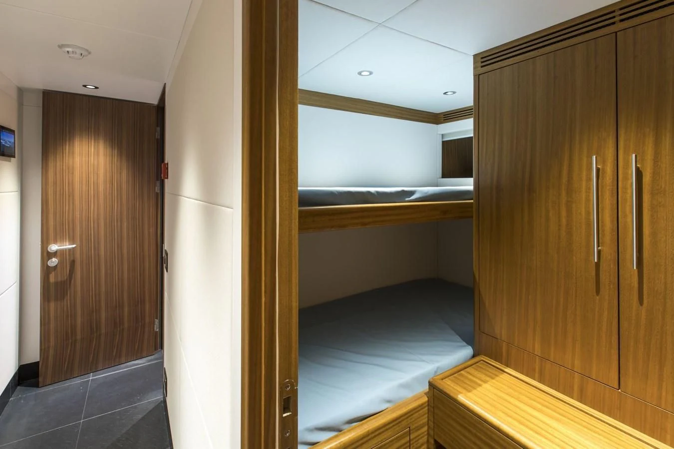 a room with a wood door and a wood cabinet aboard MAJESTY 155 Yacht for Sale