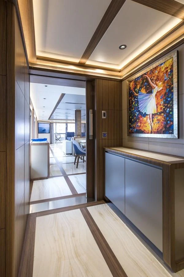 a hallway with a painting on the wall aboard MAJESTY 155 Yacht for Sale