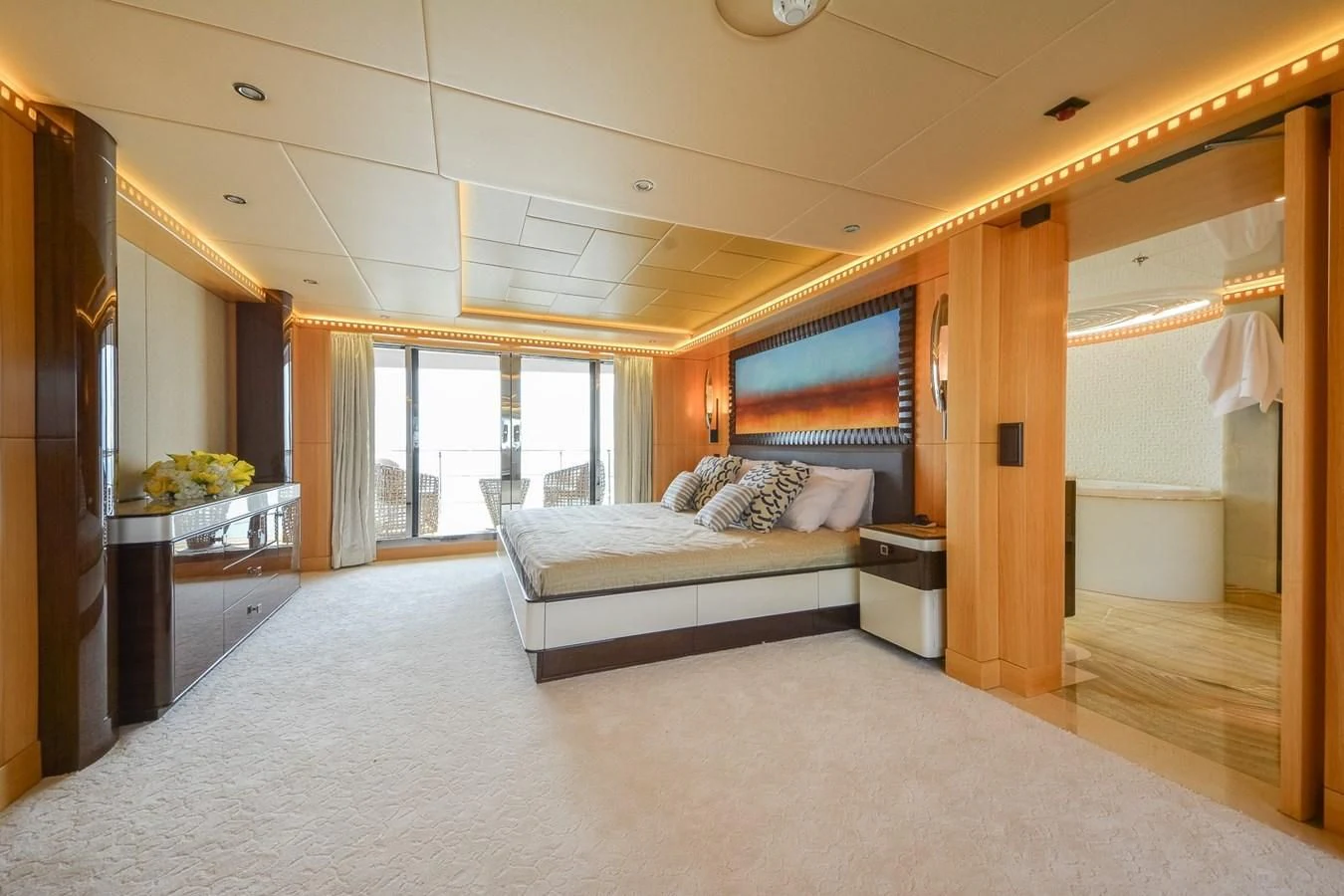 a bedroom with a bed and a desk aboard MAJESTY 155 Yacht for Sale