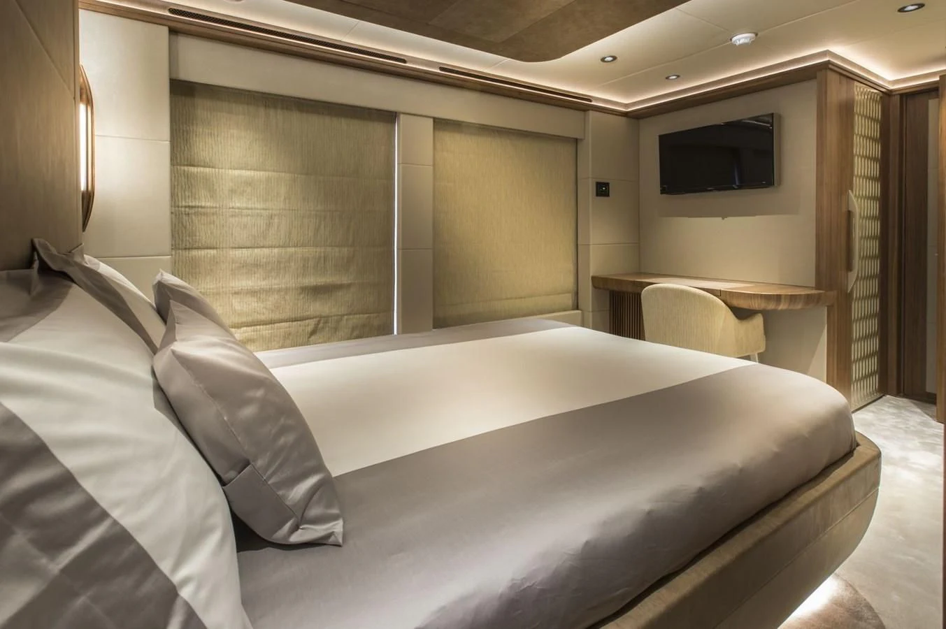 a bed with a white sheet aboard MAJESTY 155 Yacht for Sale
