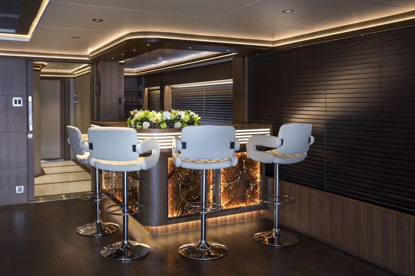 a room with chairs and tables aboard MAJESTY 155 Yacht for Sale