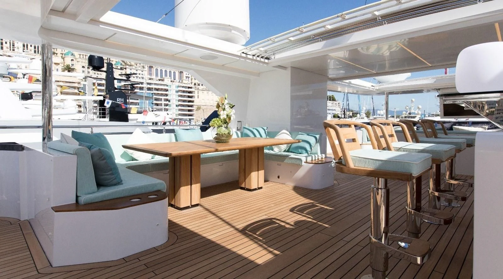 a room with tables and chairs aboard MAJESTY 155 Yacht for Sale