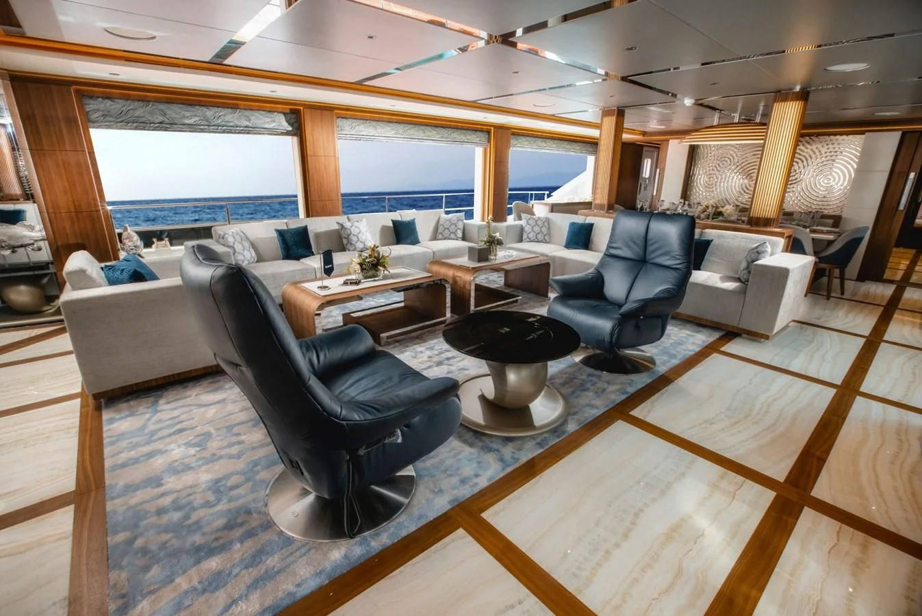 a living room with a wood floor aboard MAJESTY 155 Yacht for Sale