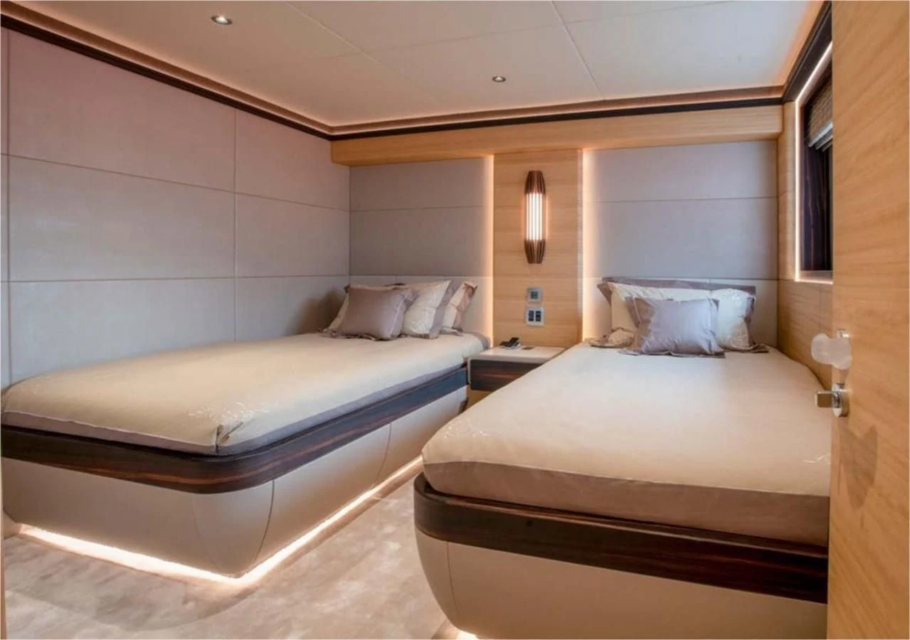 a couple of beds in a room aboard MAJESTY 155 Yacht for Sale