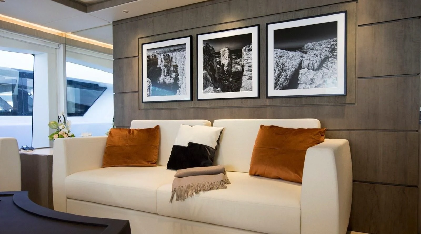 a couch with pillows aboard MAJESTY 155 Yacht for Sale