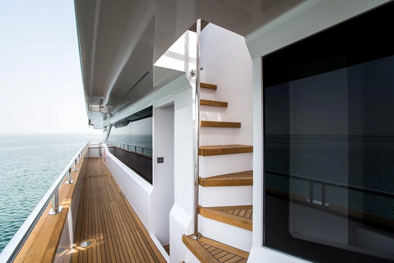 a wooden staircase leading to a beach aboard MAJESTY 155 Yacht for Sale