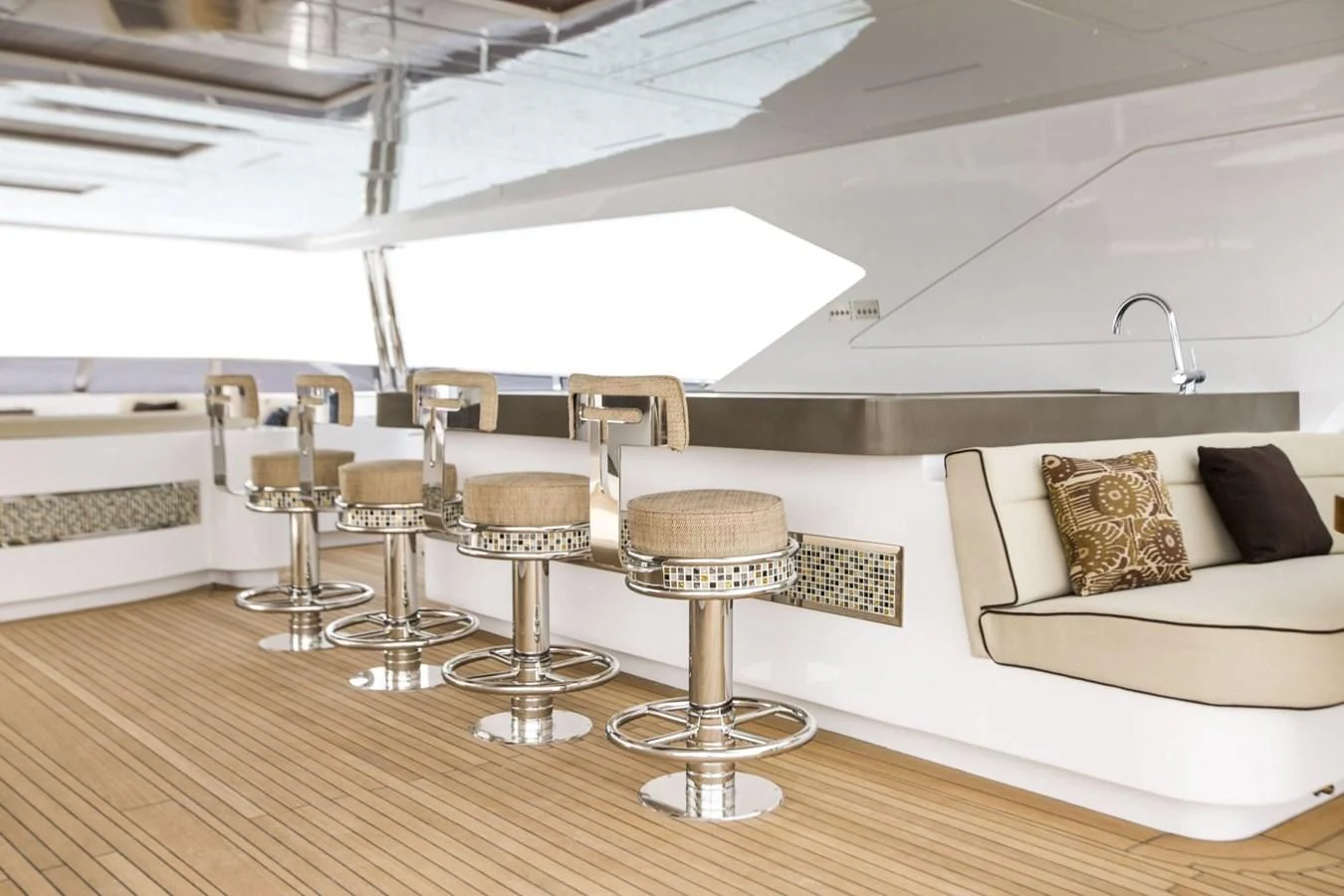 a room with a table and chairs aboard MAJESTY 155 Yacht for Sale