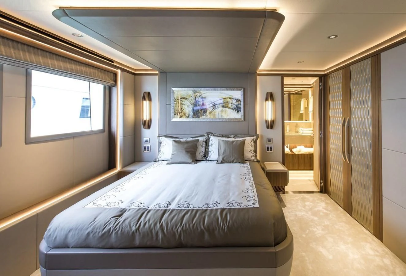 a bed in a room aboard MAJESTY 155 Yacht for Sale
