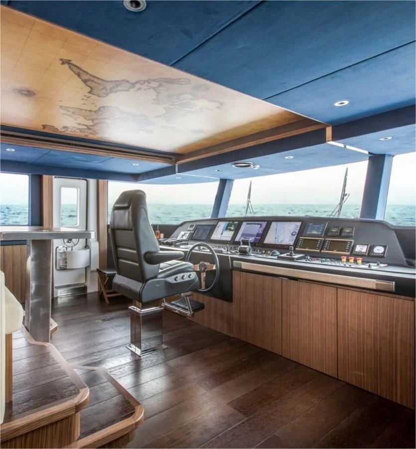 a chair in a room aboard MAJESTY 155 Yacht for Sale