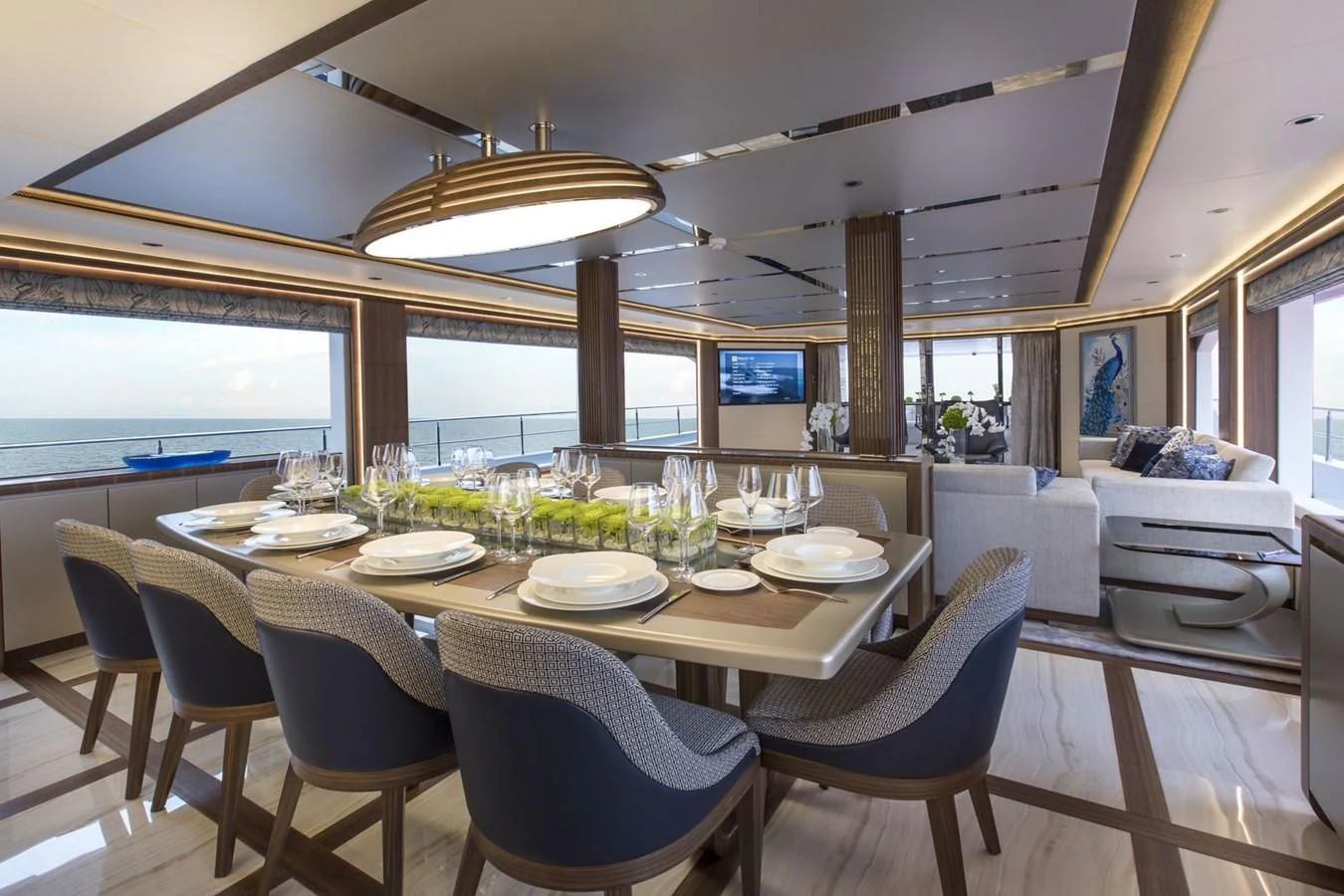 a dining room with a table set for a meal aboard MAJESTY 155 Yacht for Sale