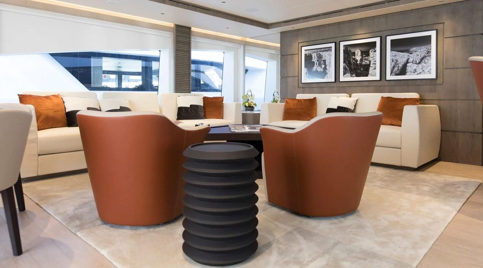 a room with a couch and a table aboard MAJESTY 155 Yacht for Sale