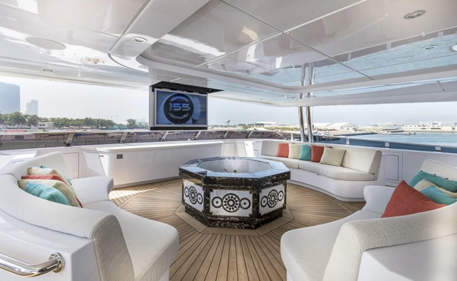 a large living room with a large fireplace aboard MAJESTY 155 Yacht for Sale