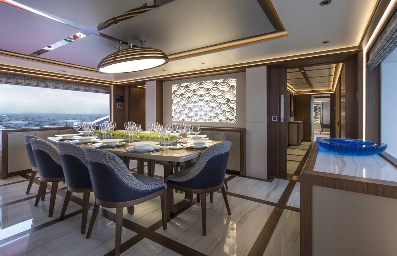 a dining room with a table and chairs aboard MAJESTY 155 Yacht for Sale