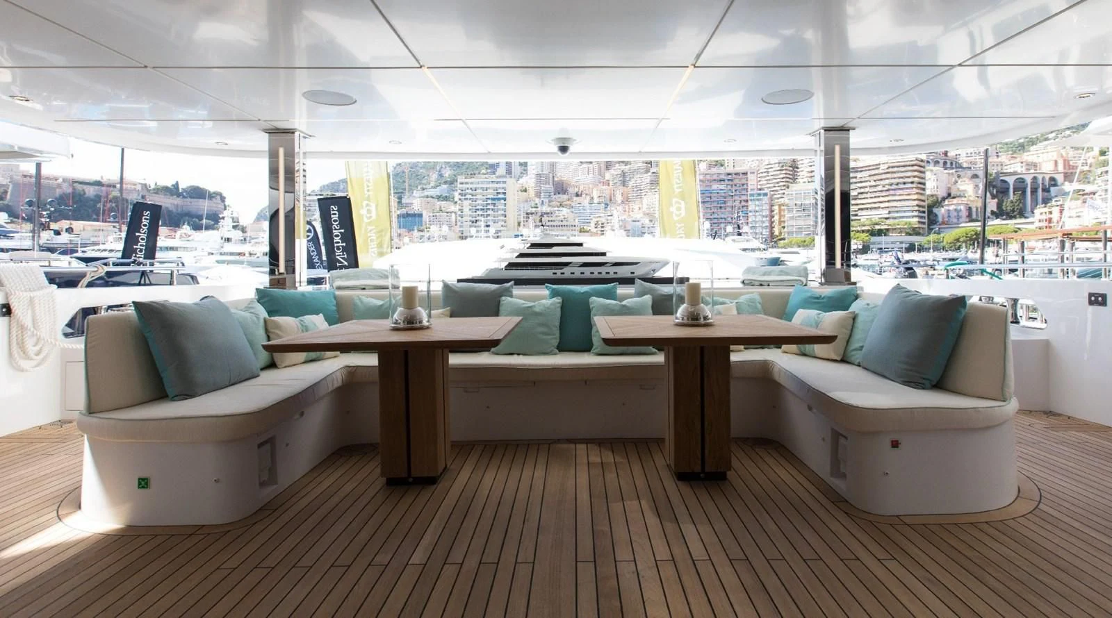 a room with a table and chairs aboard MAJESTY 155 Yacht for Sale