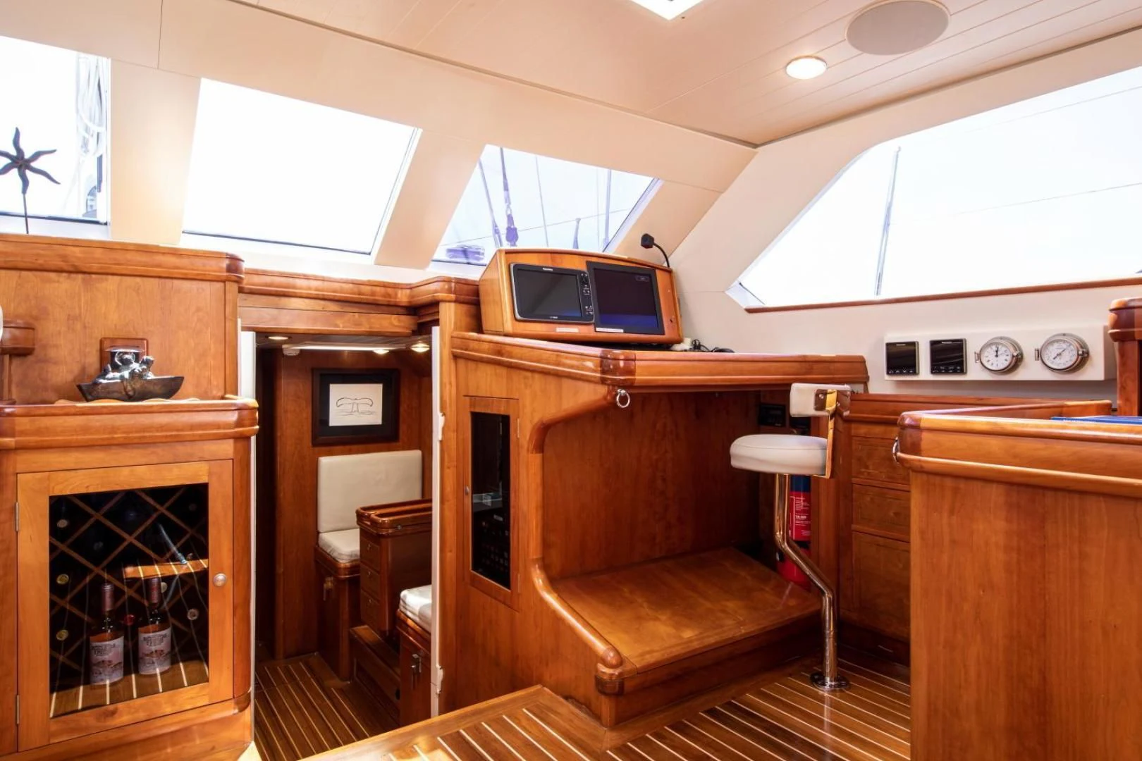 a living room with a tv and a couch aboard WAVELENGTH Yacht for Sale