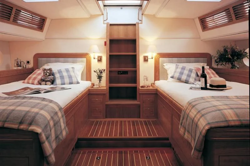 a couple of beds in a hotel room aboard WAVELENGTH Yacht for Sale